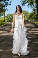 Exquisite Lace Wedding Gown with Flowing Ruffled Skirt