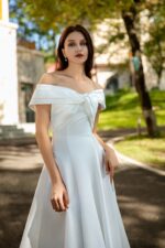 Waist-Enhancing Satin Bridal Gown with Bow Design