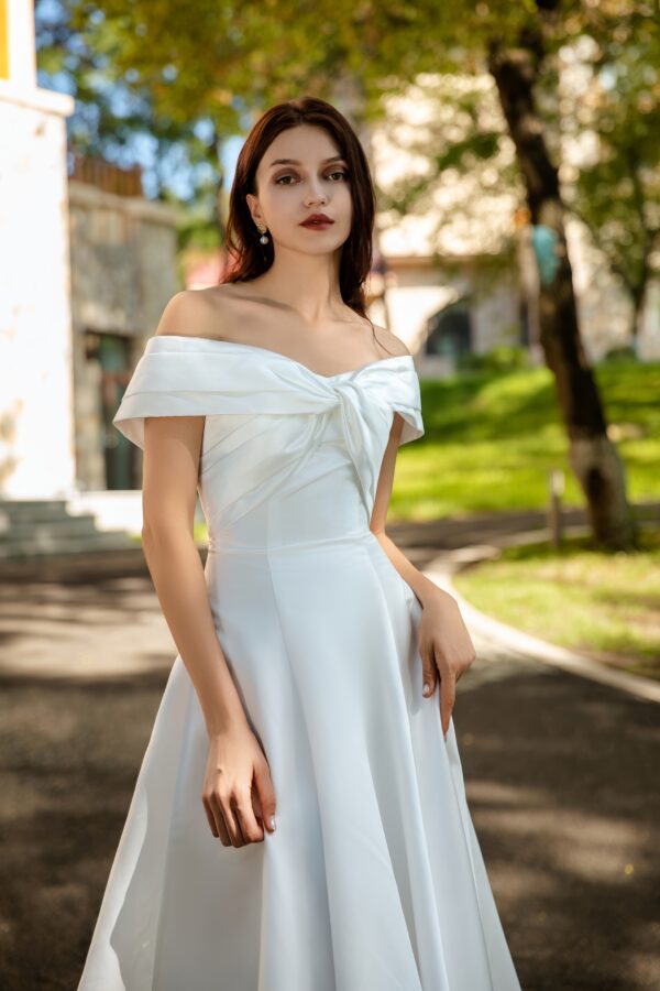 Waist-Enhancing Satin Bridal Gown with Bow Design