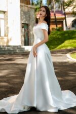 Waist-Enhancing Satin Bridal Gown with Bow Design