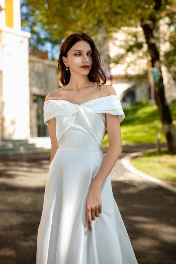 Waist-Enhancing Satin Bridal Gown with Bow Design