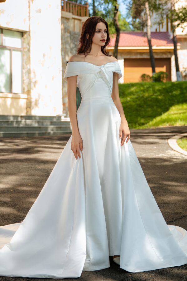 Waist-Enhancing Satin Bridal Gown with Bow Design