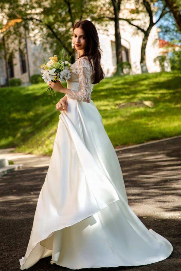 Pearlescent Satin Bridal Gown with Beaded Lace Neckline