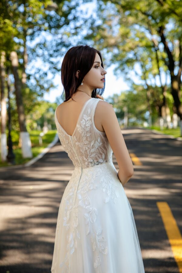 Effortless Grace Wedding Gown with V-Neckline and Ruched Bodice