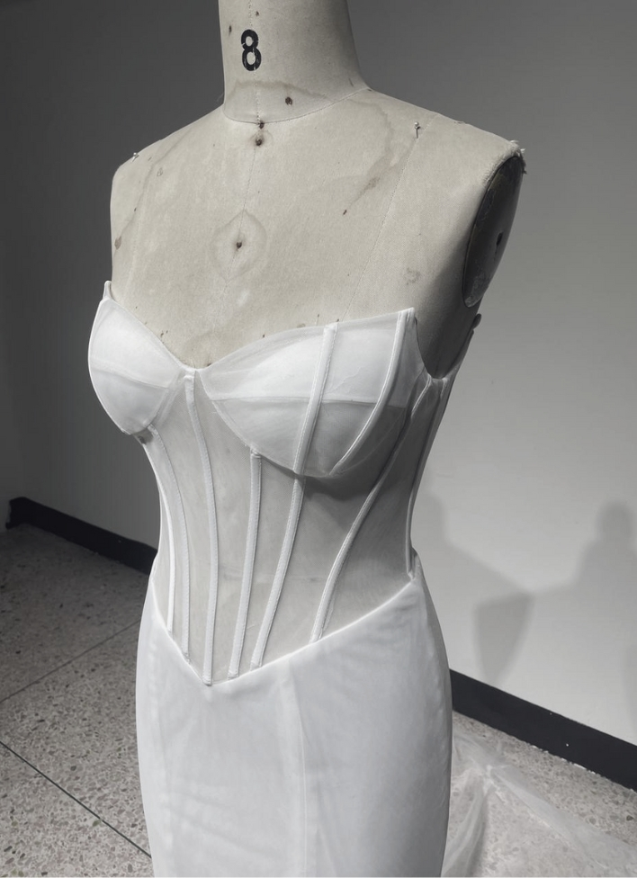 Silhouette and fit check of a custom wedding dress during production at Solinni