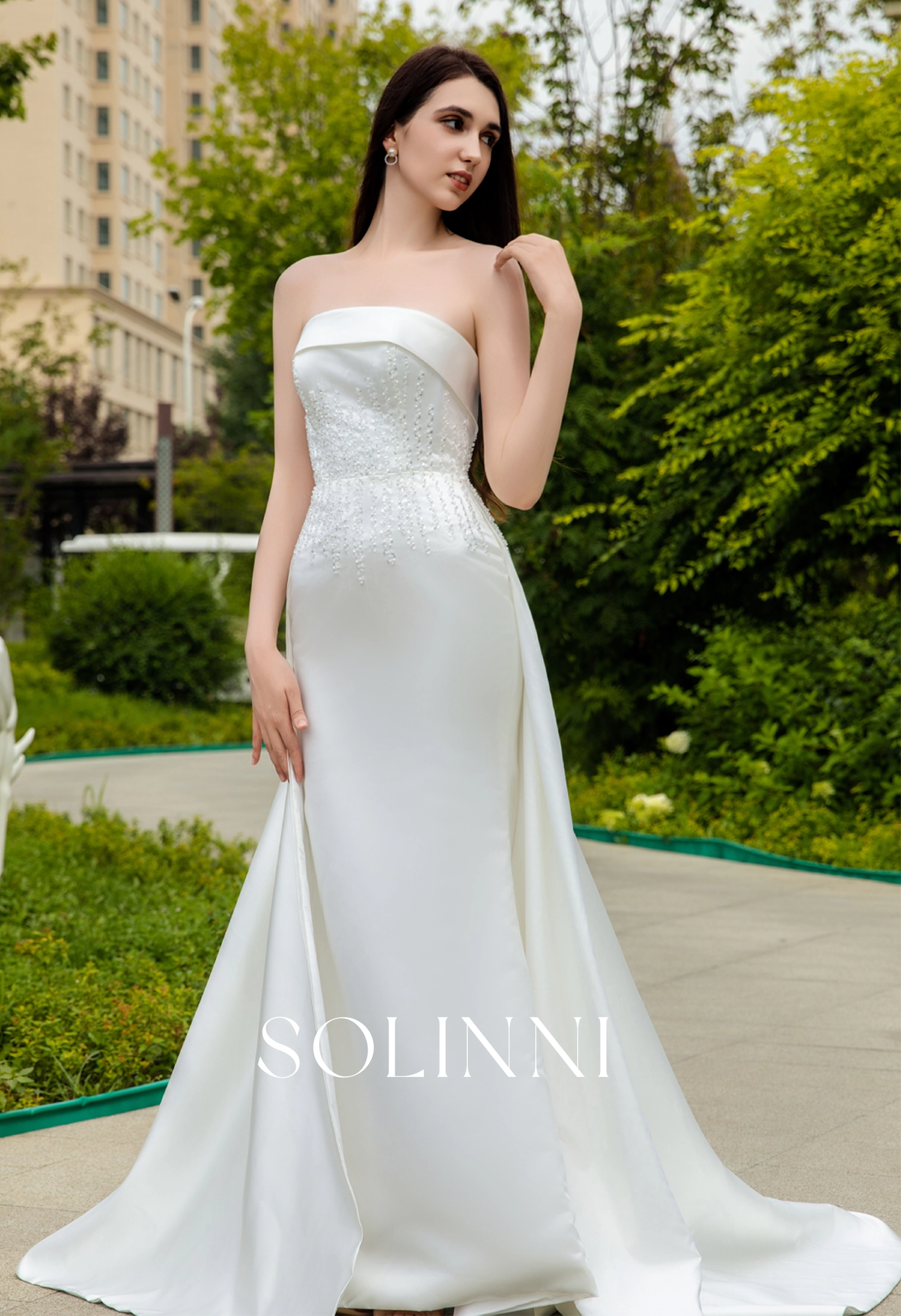Sleek Satin Bridal Gown with Pearl-Embellished Waist and Sweep Train